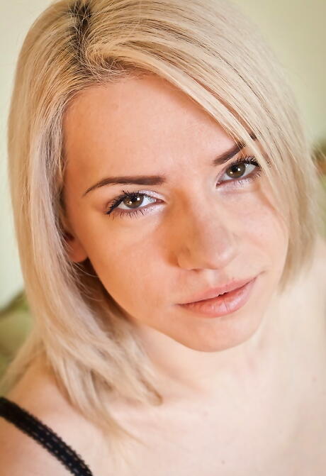 Stunning blonde babe Selena baring her butt and spreading her legs 